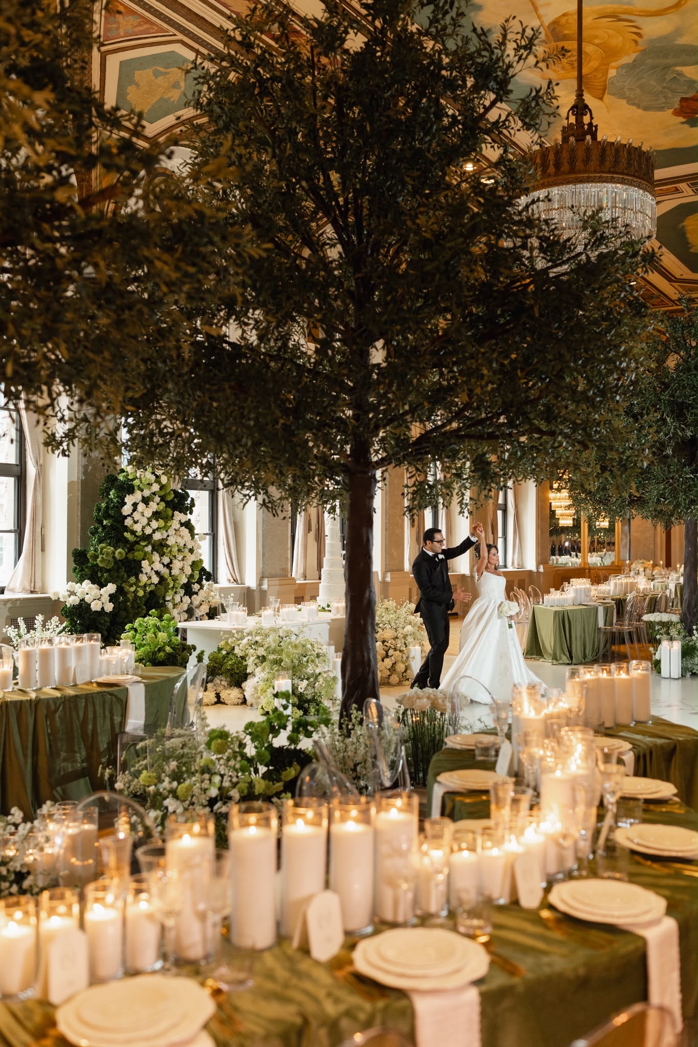Olive green tables, white flowers and candlelight in a Fairmont Royal York wedding reception